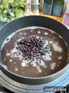 Adding beans and bean water to rice