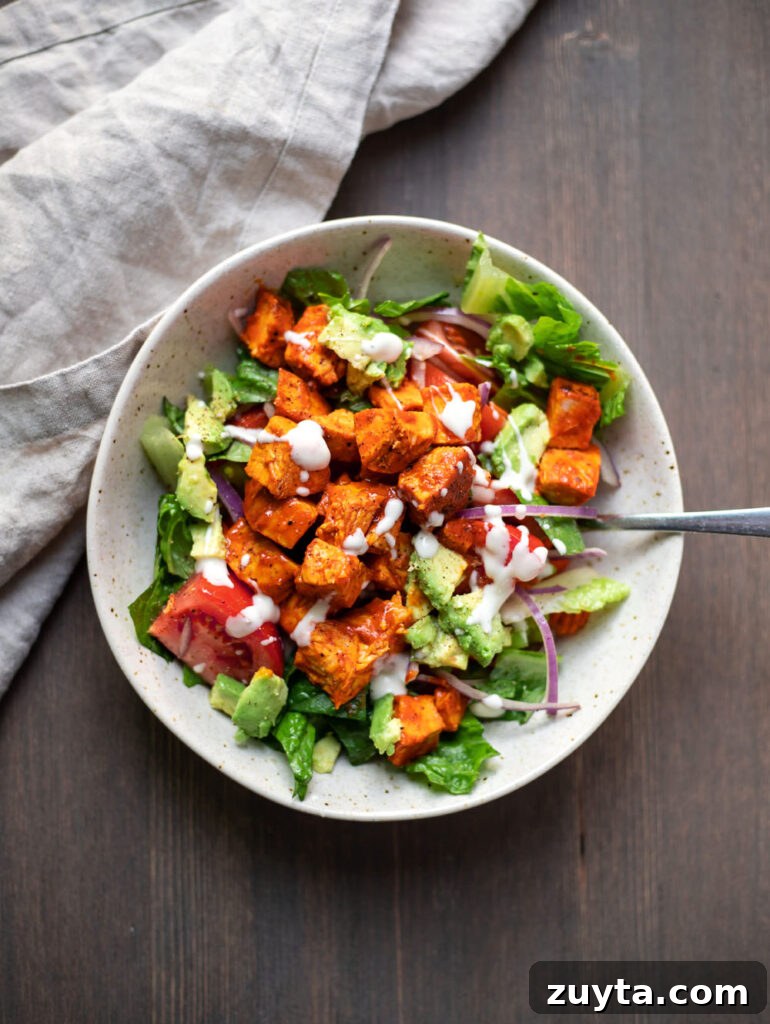 Buffalo chicken avocado salad on a plate