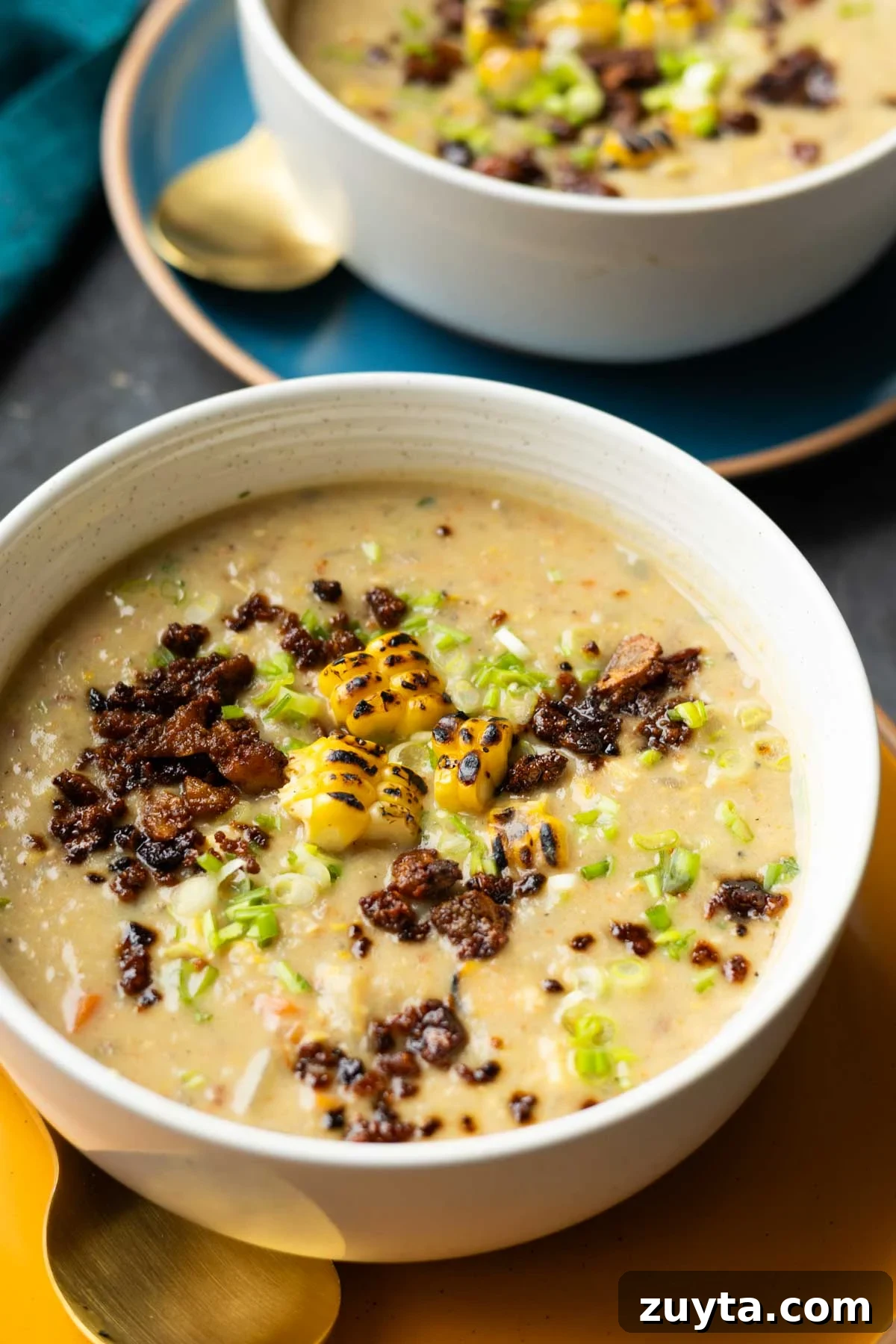 Creamy Corn Chowder with Smoky Tofu Bacon Bits 2 close-up of corn chowder in bowls with all the toppings