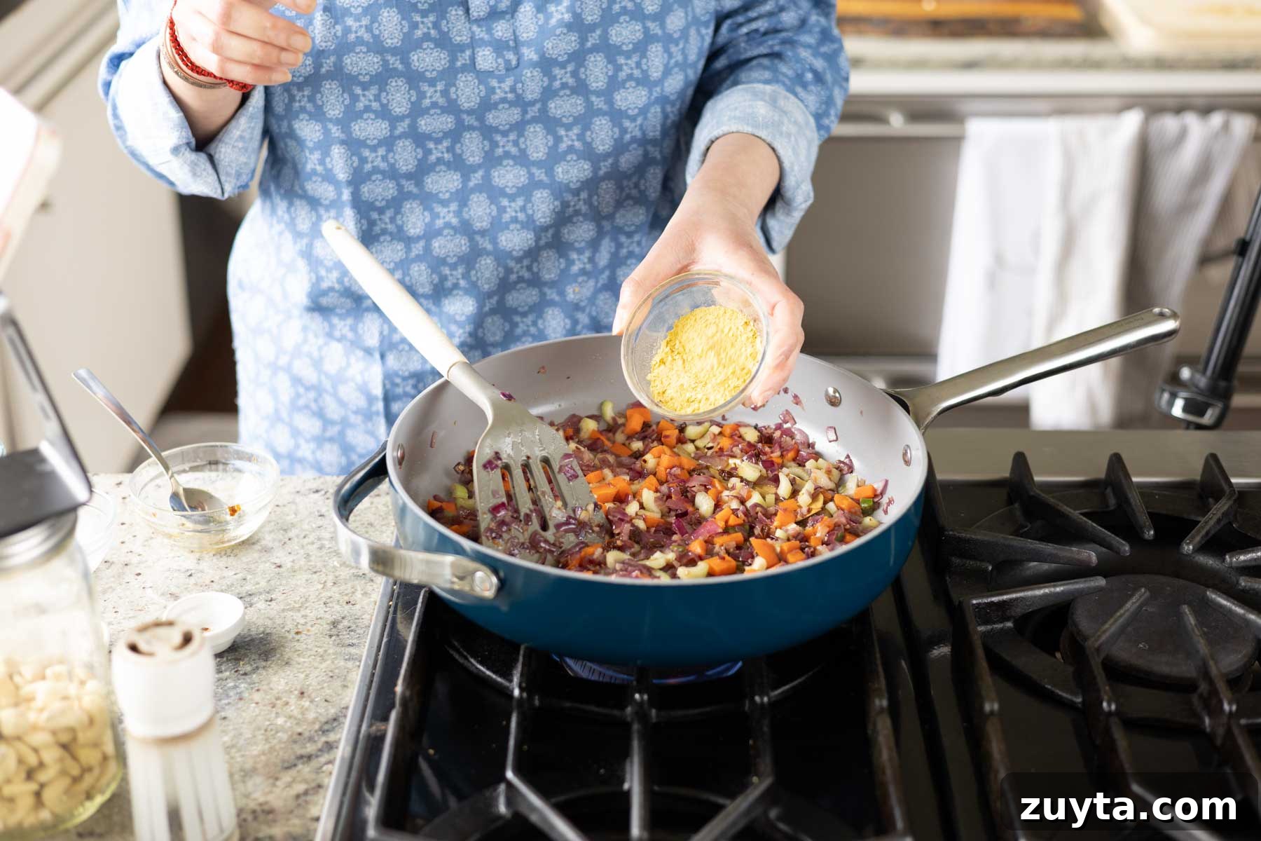 Creamy Corn Chowder with Smoky Tofu Bacon Bits 12 adding nutritional yeast to the cooked veggies