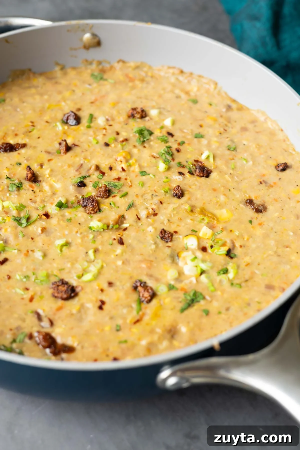 Creamy Corn Chowder with Smoky Tofu Bacon Bits 5 close-up of corn chowder in the pan