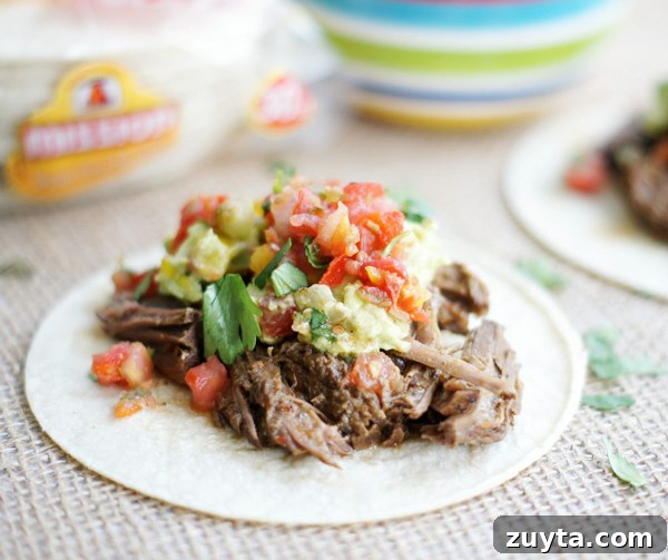 Slow Cooker Chipotle Copycat Barbacoa Beef 3 Shredded Barbocoa Beef in a bowl