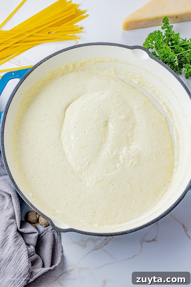 5-Ingredient Creamy Homemade Alfredo Sauce 2 Big pan with creamy alfredo sauce