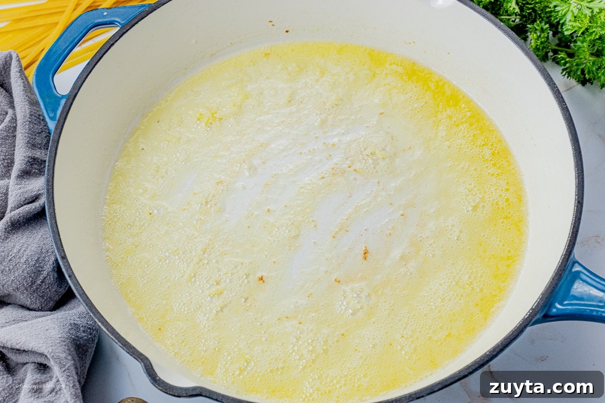 5-Ingredient Creamy Homemade Alfredo Sauce 4 melted butter with garlic in a large skillet