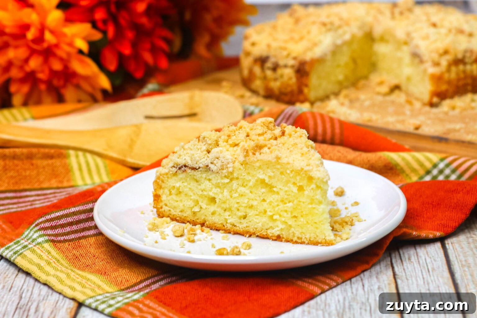 Pumpkin Spice Coffee Cake with Cinnamon Streusel 4 Slice of pumpkin spice coffee cake on a plate