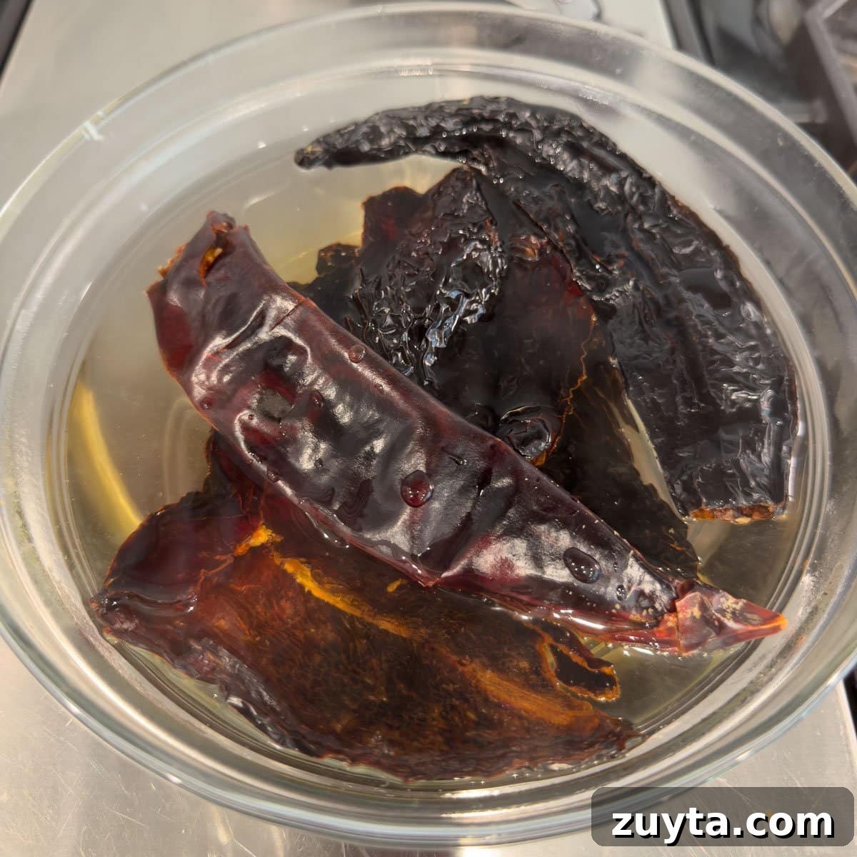 Soaked dried chili pepper in a glass bowl.