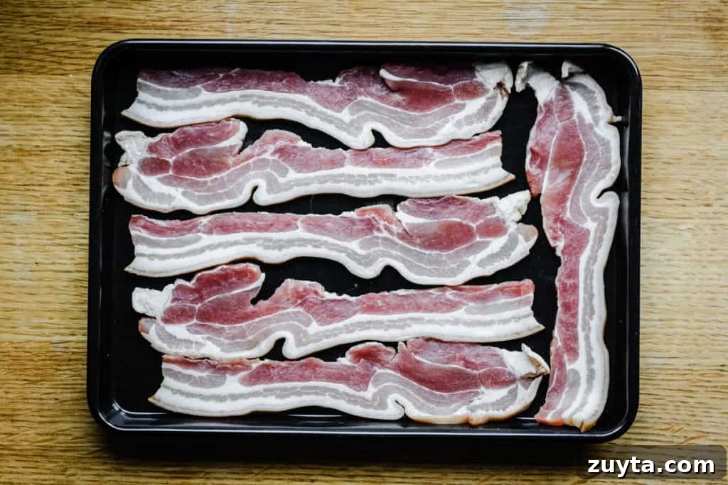 Bacon Salt: How to Use It, Recipe Ideas and Flavor Pairings 2 Raw bacon on a roasting dish