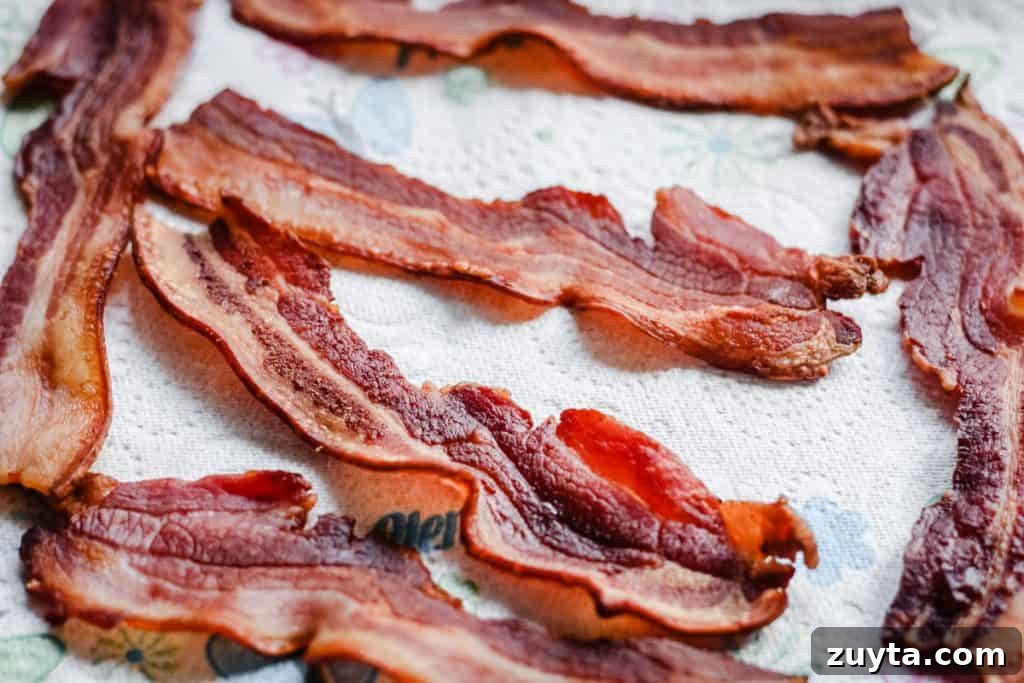 Bacon resting on kitchen paper