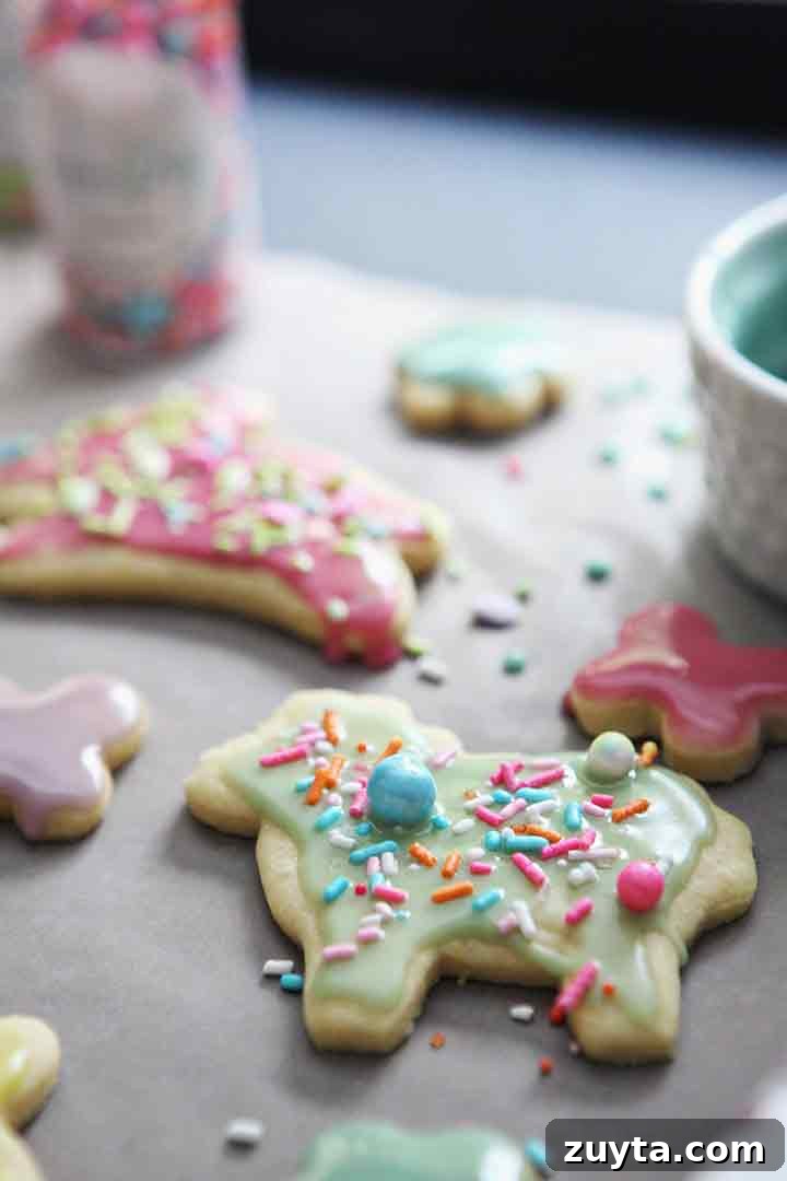 Lemon Tea Cakes Recipe with Zesty Glaze 8 Decorated Lemon Tea Cake Cookies sit on wax paper, cooling