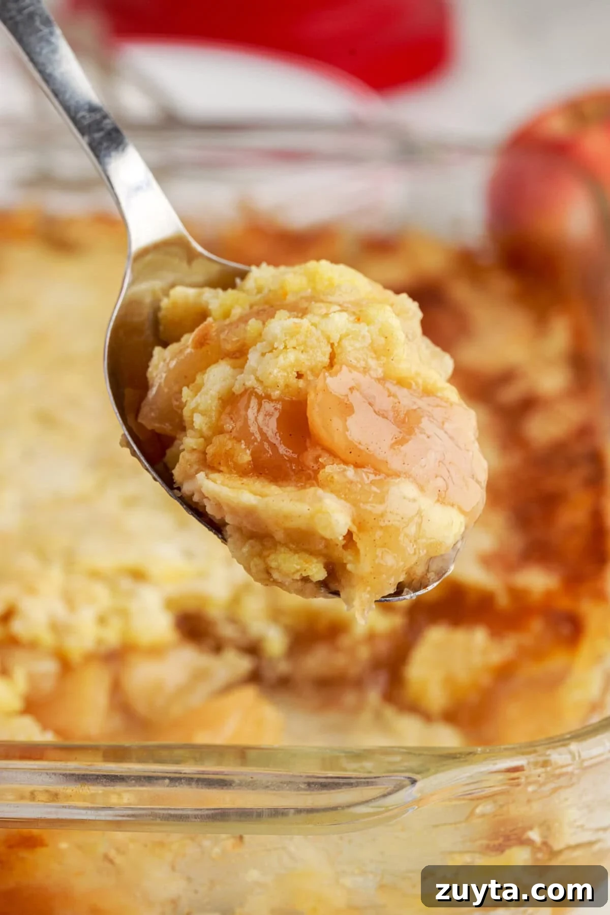Classic Apple Dump Cake Recipe with Cinnamon 2 Close up photo of a spoonful of Apple Dump Cake