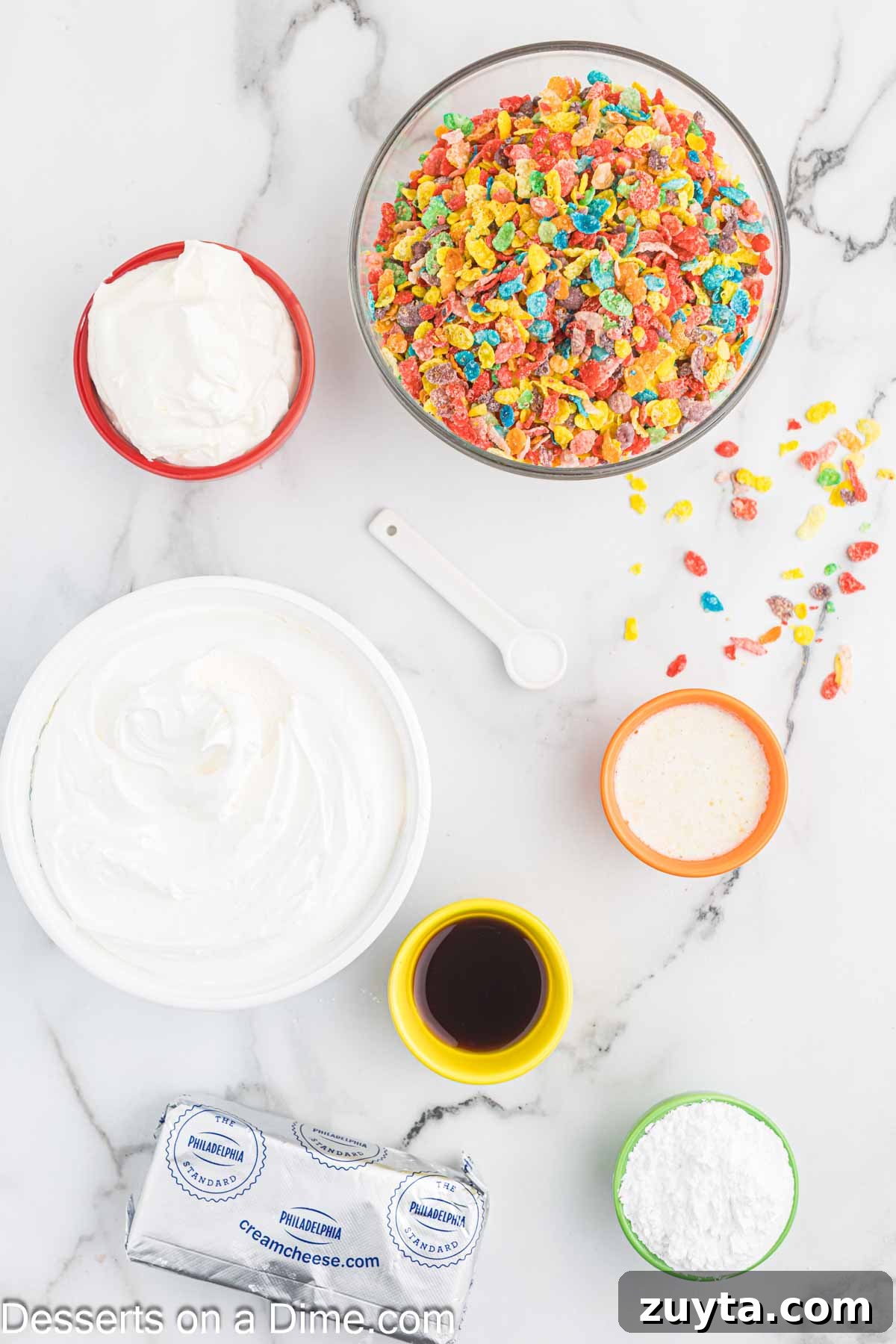 Fruity Pebbles Cheesecake Recipe with Rainbow Cereal Topping 3 Ingredients for Fruity Pebbles Cheesecake - Fruity Pebbles cereal, butter, cream cheese, sour cream, powdered sugar, vanilla, cool whip.