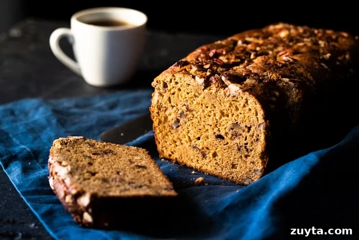 Keto Banana-Style Bread (Gluten and Grain Free) 3 A sliced keto banana bread with a cup of coffee