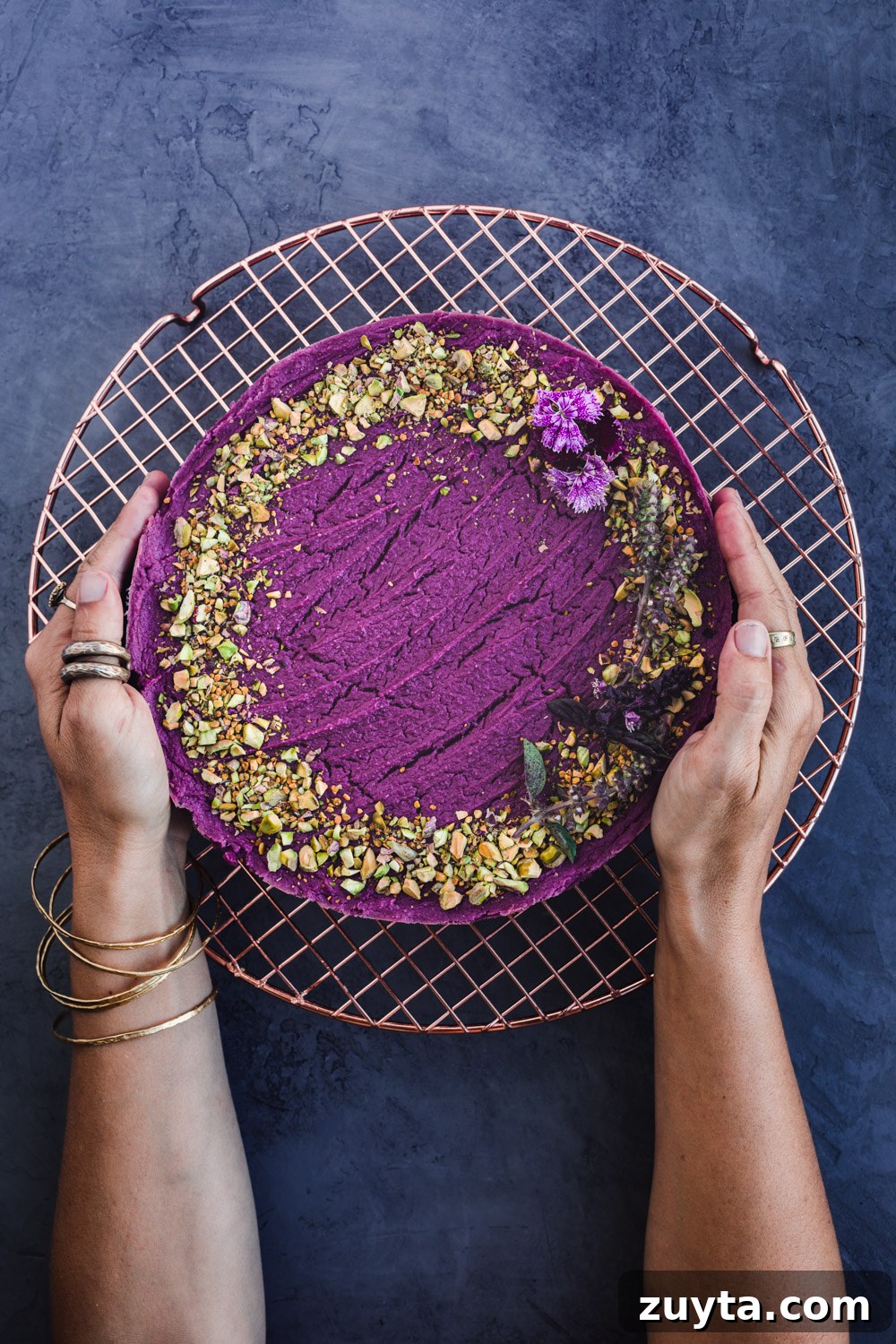 Chef Daniela Gerson holding her freshly made sweet potato cheesecake.