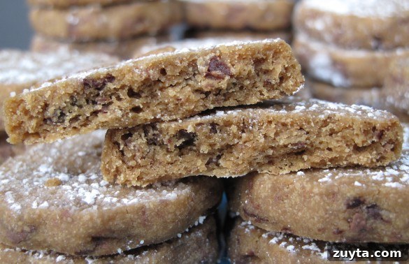 A cookie cut in half to show inside of Espresso Chocolate Shortbread Cookies.